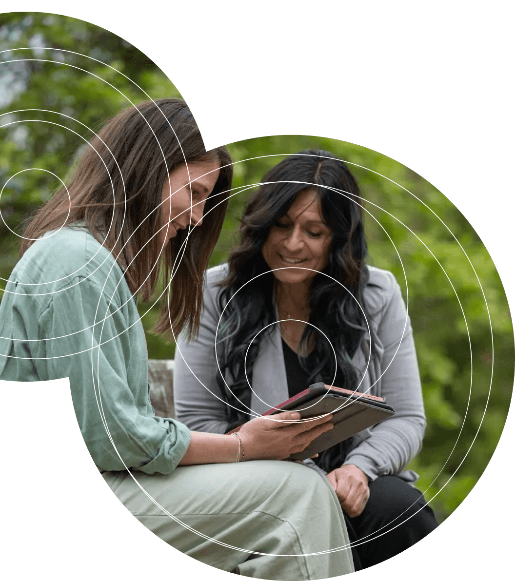 Two people looking at tablet together