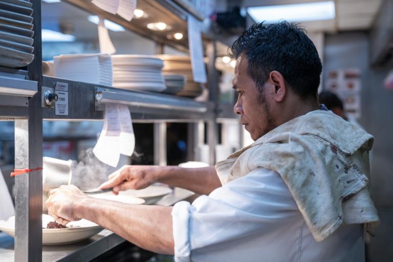 A chef concentrates on perfecting service.